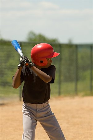 Baseball player swinging a baseball bat Stock Photo - Premium Royalty-Free, Code: 625-01038156