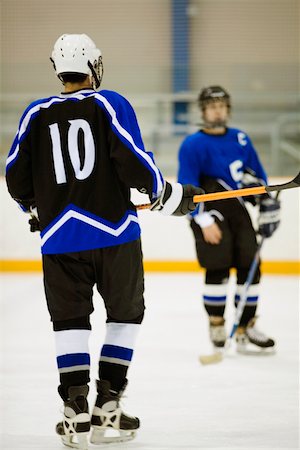 simsearch:625-01038051,k - Close-up of two ice hockey players playing ice hockey Stock Photo - Premium Royalty-Free, Code: 625-01038168