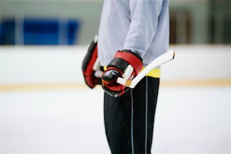 simsearch:625-01038051,k - Mid section view of an ice hockey player holding an ice hockey stick Stock Photo - Premium Royalty-Free, Code: 625-01038162