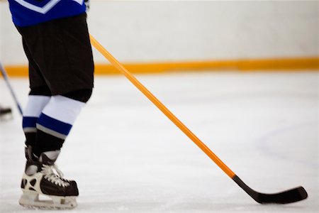 simsearch:625-01038051,k - Low section view of an ice hockey player holding an ice hockey stick Stock Photo - Premium Royalty-Free, Code: 625-01038248