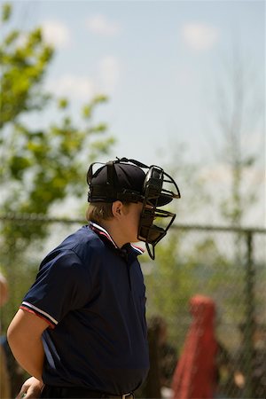 simsearch:625-01038259,k - Side profile of a baseball umpire wearing a helmet Stock Photo - Premium Royalty-Free, Code: 625-01038256