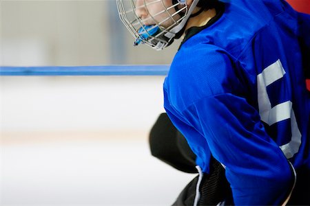 Side profile of an ice hockey player wearing a helmet Stock Photo - Premium Royalty-Free, Code: 625-01038253