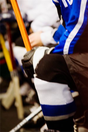 simsearch:625-01038051,k - Mid section view of an ice hockey player holding an ice hockey stick Stock Photo - Premium Royalty-Free, Code: 625-01038278