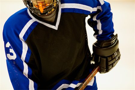 simsearch:625-01038051,k - Mid section view of an ice hockey player holding an ice hockey stick Stock Photo - Premium Royalty-Free, Code: 625-01038281