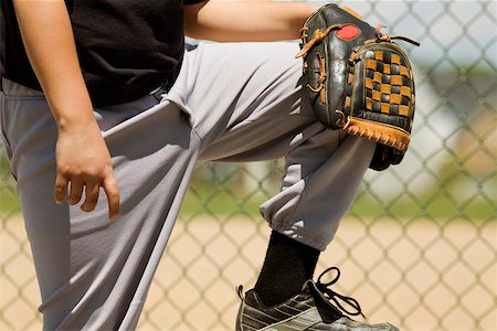 simsearch:625-01038259,k - Mid section view of a baseball player holding a baseball glove Stock Photo - Premium Royalty-Free, Code: 625-01038296