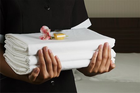 room service food - Mid section view of a woman holding sheets Stock Photo - Premium Royalty-Free, Code: 625-01038804
