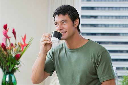 Mid adult man drinking a cup of tea Stock Photo - Premium Royalty-Free, Code: 625-01038960