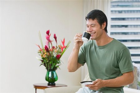 Mid adult man drinking a cup of tea Stock Photo - Premium Royalty-Free, Code: 625-01038993