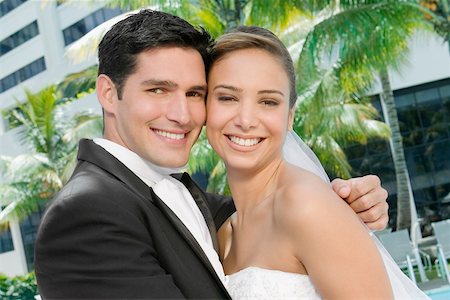 simsearch:640-01363662,k - Portrait of a newlywed couple embracing each other Stock Photo - Premium Royalty-Free, Code: 625-01039022