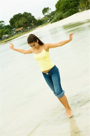 simsearch:625-00902214,k - Girl standing in a lake with her arms outstretched Stock Photo - Premium Royalty-Free, Code: 625-01039098