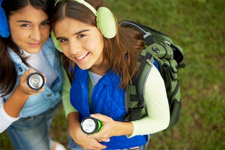 High angle view of two mid adult women holding a flashlight Stock Photo - Premium Royalty-Free, Code: 625-01039317