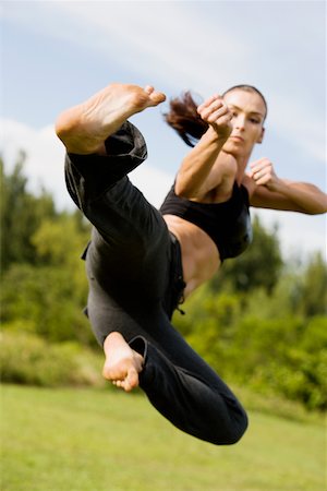 simsearch:625-00901737,k - Mid adult woman practicing martial arts Stock Photo - Premium Royalty-Free, Code: 625-01039412