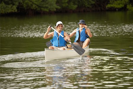 Two mid adult men canoeing Stock Photo - Premium Royalty-Free, Code: 625-01039423