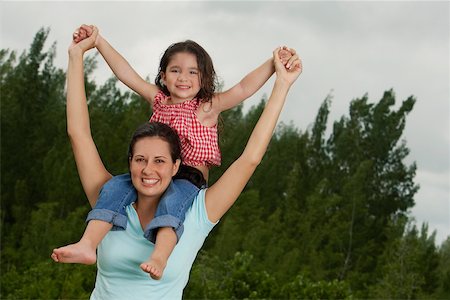 simsearch:625-00848874,k - Portrait of a girl sitting on her mother's shoulder Foto de stock - Sin royalties Premium, Código: 625-01039442