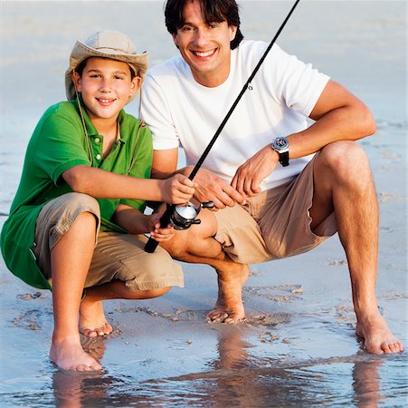 Portrait of a father and his son fishing Stock Photo - Premium Royalty-Free, Code: 625-01039701