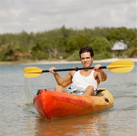 portrait and kayak - Portrait of a young man kayaking Stock Photo - Premium Royalty-Free, Code: 625-01039772