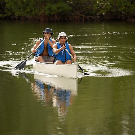 Two mid adult men canoeing Stock Photo - Premium Royalty-Free, Code: 625-01039773