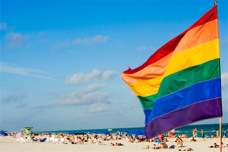 picture gay umbrella - Close-up of a flag fluttering on the beach Stock Photo - Premium Royalty-Free, Code: 625-01039804