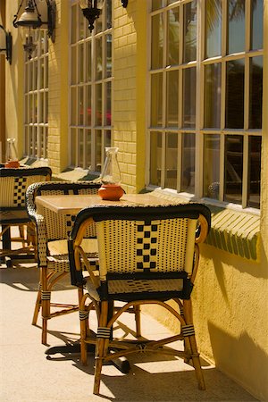 sidewalk cafe empty - Empty chairs at a sidewalk cafe Stock Photo - Premium Royalty-Free, Code: 625-01039954