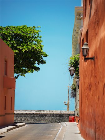 Buildings on both sides of a road Cartagena, Colombia Stock Photo - Premium Royalty-Free, Code: 625-01040127