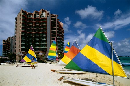 sailboat beach - Colorful sailboats on a beach at Crystal Palace Hotel, Nassau, Bahamas Stock Photo - Premium Royalty-Free, Code: 625-01040332