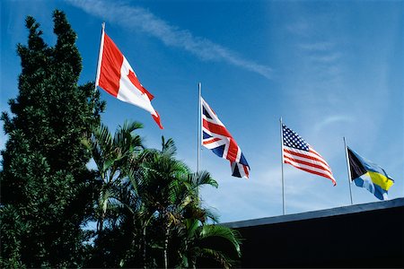 freeport - Flags fluttering due to wind on a sunny day, Freeport, Bahamas Stock Photo - Premium Royalty-Free, Code: 625-01040346