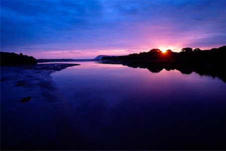 Sunset over Newport Estuary in Pembrokeshire, Wales Stock Photo - Premium Royalty-Free, Code: 625-01040559