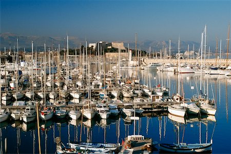 simsearch:625-01041167,k - Large group of sailboats docked at Antibes/Cote D'Azur, France Stock Photo - Premium Royalty-Free, Code: 625-01040650