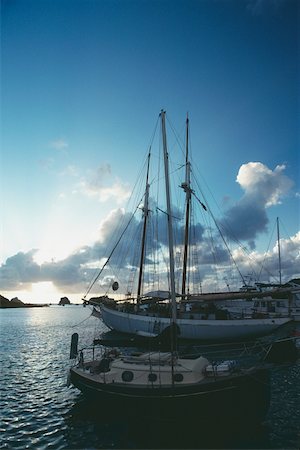 simsearch:625-01041167,k - Side view of a boat under the cloudy sky, St. Bant's Fotografie stock - Premium Royalty-Free, Codice: 625-01040876