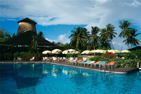 deck chair swimming pool nobody - View of a clear swimming pool at a resort, Tobago, Caribbean Stock Photo - Premium Royalty-Free, Code: 625-01041030