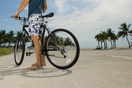 simsearch:625-01095436,k - Man standing with his bicycle on the road Stock Photo - Premium Royalty-Free, Code: 625-01094038