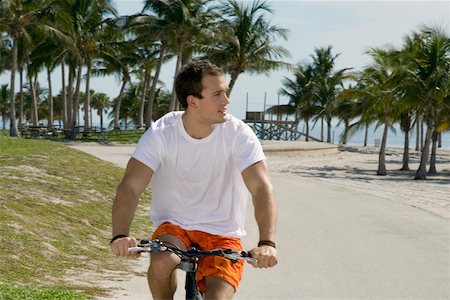 simsearch:625-01095436,k - Close-up of a young man cycling on the road Stock Photo - Premium Royalty-Free, Code: 625-01094039
