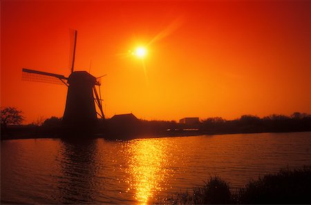 Silhouette of a traditional windmill at dusk, Amsterdam, Netherlands Stock Photo - Premium Royalty-Free, Code: 625-01094076