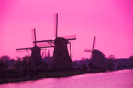 Silhouette of traditional windmills at dusk, Amsterdam, Netherlands Stock Photo - Premium Royalty-Free, Code: 625-01094072