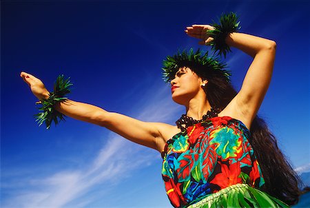 simsearch:640-02769299,k - Vue angle faible sur un hula danseur, Hawaii, USA Photographie de stock - Premium Libres de Droits, Code: 625-01094479