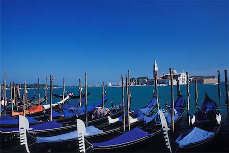 docked gondola buildings - High angle view of gondolas moored at a dock, Italy Stock Photo - Premium Royalty-Free, Code: 625-01094555