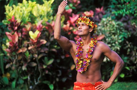 Close-up of a young man wearing a garland, Hawaii, USA Stock Photo - Premium Royalty-Free, Code: 625-01094790
