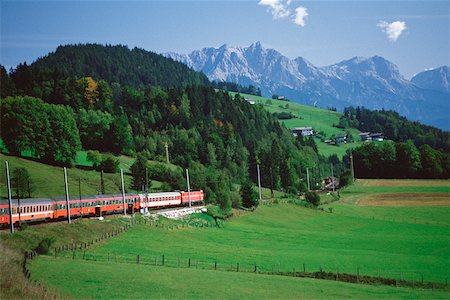 Train passing through a hillside, Innsbruck, Austria Stock Photo - Premium Royalty-Free, Code: 625-01095173