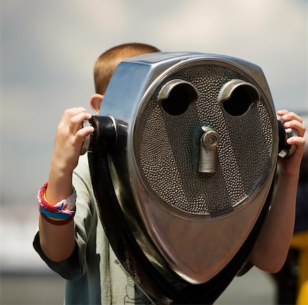 Close-up of a person looking through coin-operated binoculars, New York City, New York State, USA Stock Photo - Premium Royalty-Free, Code: 625-01095358