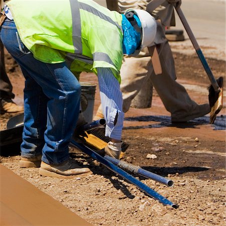 simsearch:625-01097225,k - Three construction workers working at a construction site Stock Photo - Premium Royalty-Free, Code: 625-01095366