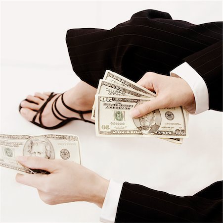 High angle view of a businesswoman holding dollar bills Fotografie stock - Premium Royalty-Free, Codice: 625-01095413