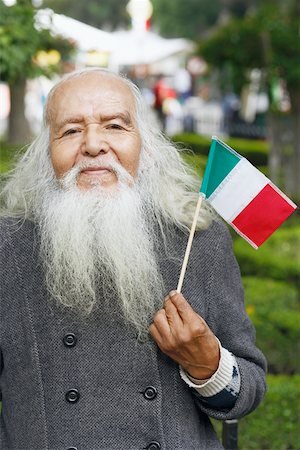 family portrait with flags - Portrait of a senior man holding a Mexican flag Stock Photo - Premium Royalty-Free, Code: 625-01096353