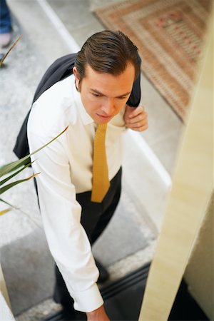 High angle view of a businessman opening a door Stock Photo - Premium Royalty-Free, Code: 625-01096654