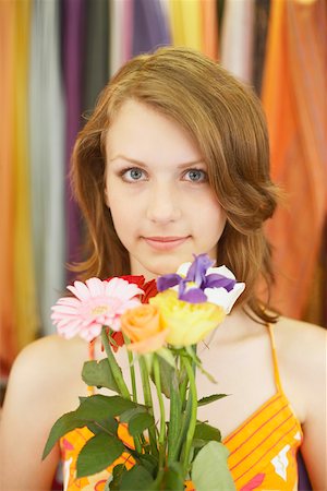 Portrait of a teenage girl holding a bouquet of flowers Stock Photo - Premium Royalty-Free, Code: 625-01096858