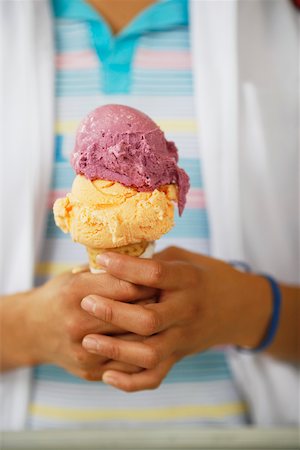 Mid section view of a person holding an ice-cream Stock Photo - Premium Royalty-Free, Code: 625-01096993