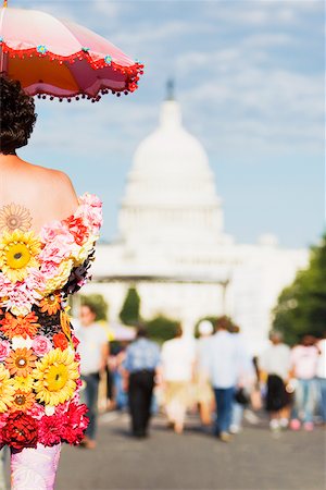 simsearch:625-01097146,k - Vue arrière d'une personne dans un costume de fleur à une parade gay Photographie de stock - Premium Libres de Droits, Code: 625-01097158