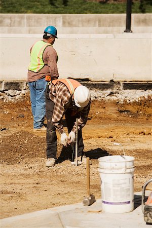 simsearch:625-01097225,k - Two construction workers working at a construction site Stock Photo - Premium Royalty-Free, Code: 625-01097203