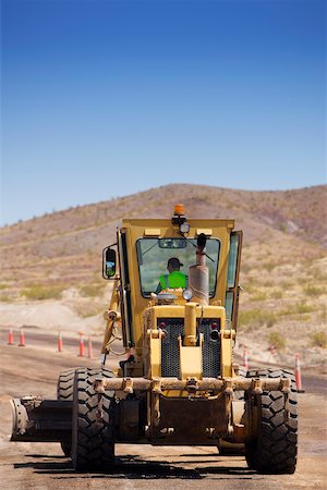 simsearch:625-01097225,k - Bulldozer moving on a dirt road Stock Photo - Premium Royalty-Free, Code: 625-01097227