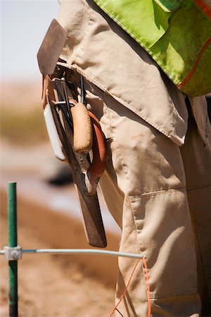 simsearch:625-01097225,k - Mid section view of a construction worker carrying hand tools Stock Photo - Premium Royalty-Free, Code: 625-01097222