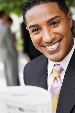 simsearch:625-01096675,k - Portrait of a businessman smiling Stock Photo - Premium Royalty-Free, Code: 625-01097574